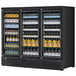 A black Turbo Air refrigerated merchandiser full of beverage bottles.