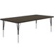 A rectangular Correll activity table with metal legs and a walnut top.