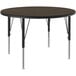 A Correll round activity table with black metal legs and a walnut top.