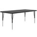 A rectangular black table with silver legs.