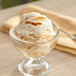 A bowl of ice cream with Oringer Burnt Caramel Variegate and a spoon.