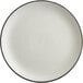 An Acopa Embers stoneware coupe plate with a matte grey finish and black rim.