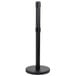 A black metal Aarco crowd control stanchion with a round base.