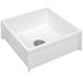 A white square fiberglass mop sink with a drain.