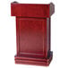 A wooden Aarco hostess podium with a pedestal.