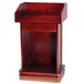 A wooden Aarco hostess podium with a shelf.