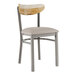 A Lancaster Table & Seating Boomerang chair with a light gray cushion and driftwood back.