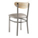 A Lancaster Table & Seating metal chair with a wooden seat and light gray cushion.