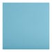 A close-up of a blue vinyl seat with an antique walnut wood back.