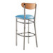 A Lancaster Table & Seating bar stool with a blue vinyl seat and metal frame.