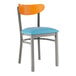 A Lancaster Table & Seating metal chair with a blue vinyl seat and cherry wood back.
