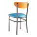 A Lancaster Table & Seating chair with a blue vinyl seat and cherry wood back and a clear coat finish.