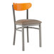A Lancaster Table & Seating Boomerang chair with a brown cushioned seat and cherry wood back.