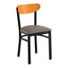 A black metal chair with a dark gray vinyl seat and a cherry wood backrest.