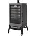 A large black and grey Louisiana Grills 7 Series vertical pellet smoker with the door open.