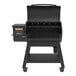 A black Louisiana Grills barbecue with a digital display and a handle.