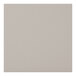 A close-up of a clear-coated cherry wood surface with a light gray vinyl square.