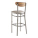 A Lancaster Table & Seating Boomerang bar stool with a wood back and white cushion.