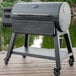 A Louisiana Grills Black Label 1200 pellet grill on a deck.