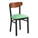 A black chair with a seafoam vinyl seat and an antique walnut wood backrest.