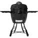 A black Louisiana Grills K24BLK Ceramic Kamado Charcoal Grill on a table with a lid.