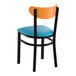 A black metal chair with a blue vinyl seat and a curved cherry wood backrest.