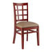 A Lancaster Table & Seating wooden chair with a taupe vinyl seat and window back.