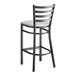 A Lancaster Table & Seating distressed copper finish ladder back bar stool with a light gray cushion.