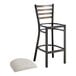 A Lancaster Table & Seating distressed copper finish metal ladder back bar stool with a light gray padded seat.