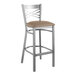 A Lancaster Table & Seating metal bar stool with a taupe cushion on the seat.