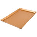 A Chicago Metallic Textured Copper bakery display tray on a counter.