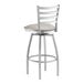 A silver Lancaster Table & Seating swivel bar stool with a light gray cushion.