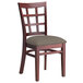 A Lancaster Table & Seating mahogany wood chair with a taupe cushion.