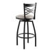 A black bar stool with a light gray cushion.