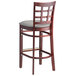 A Lancaster Table & Seating mahogany wood bar stool with a light gray cushion.