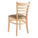 A Lancaster Table & Seating wooden restaurant chair with taupe cushioned seat and ladder back.