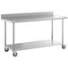 A silver metal Regency work table with wheels.