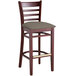 A Lancaster Table & Seating mahogany wood bar stool with a taupe vinyl cushion.