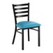 A black ladder back chair with a blue vinyl padded seat.