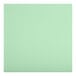 A Lancaster Table & Seating ladder back chair with a detached seafoam vinyl padded seat.