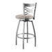 A Lancaster Table & Seating silver cross back bar stool with a light gray cushion.