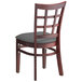 A Lancaster Table & Seating wooden chair with a dark gray cushion and back.