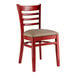 A Lancaster Table & Seating mahogany wood ladder back chair with a taupe vinyl seat.