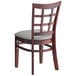 A Lancaster Table & Seating mahogany wood window back chair with light gray vinyl seat.