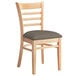 A Lancaster Table & Seating wooden ladder back chair with a taupe seat.