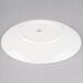 A Homer Laughlin Ameriwhite Alexa bright white china salad plate on a gray surface.