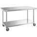 A stainless steel Regency work table with casters.