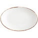 A Fortessa white china coupe platter with brown rim.