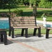 A group of MasonWays Malibu-style benches with black legs by a pool.