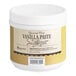 A white container of Regal Pure Vanilla Bean Paste with a white lid and yellow label.